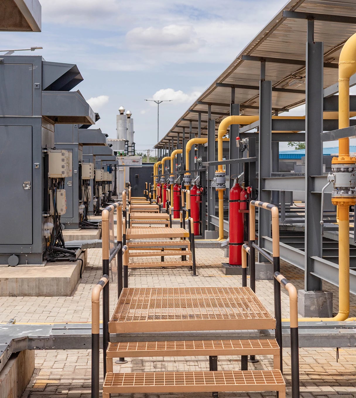 Compressor units and yellow gas pipework at the Gas Tech NGV Filling Station