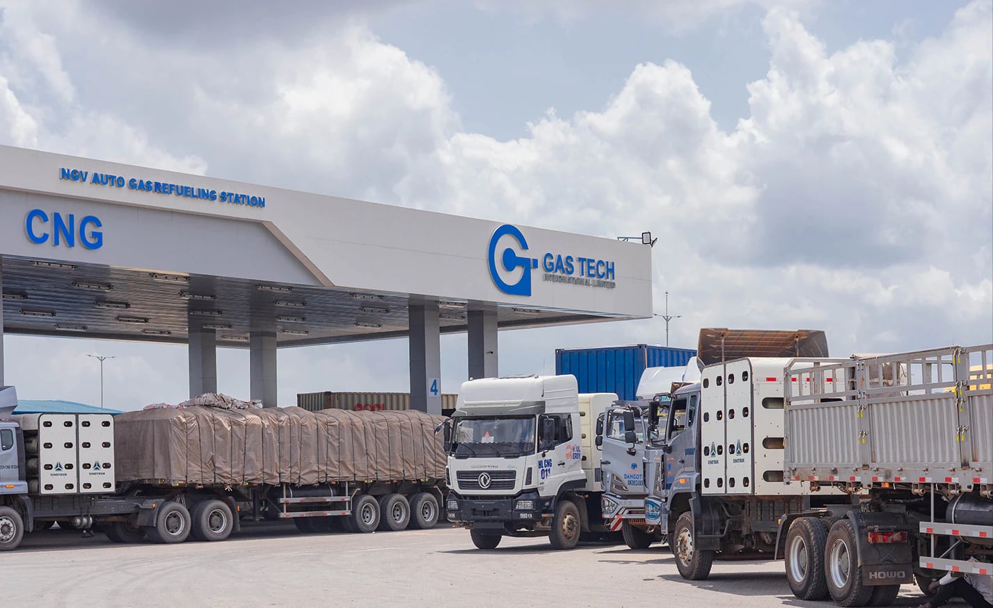 CNG trucks lined up under the Gas Tech NGV Filling Station canopy