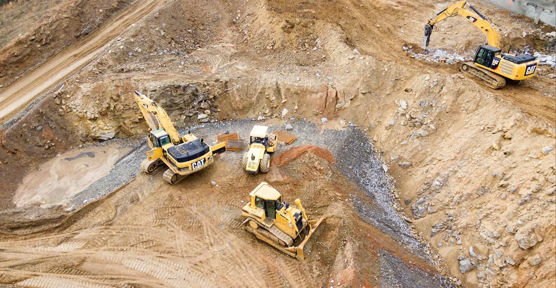 Aerial view of excavators and a bulldozer clearing the Sagamu NGV Station expansion site