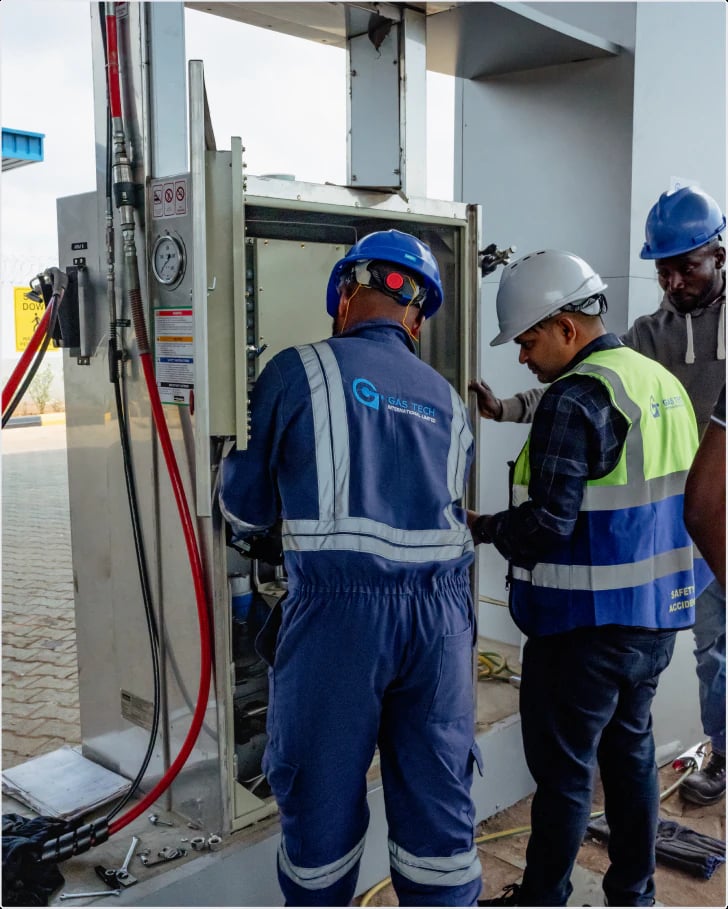 Gas Tech engineers working at a control panel