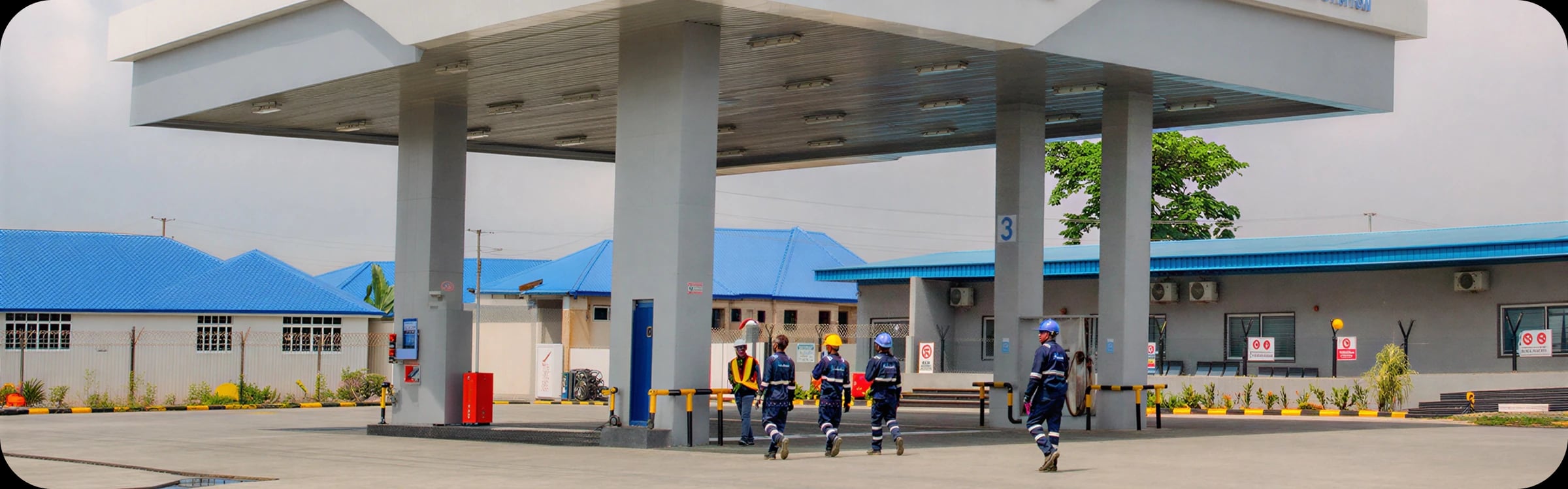 Gas Tech crew walking under the mother station canopy